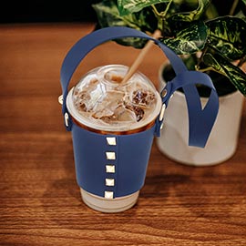 Studded Faux Leather Coffee Cup Sleeve With Strap